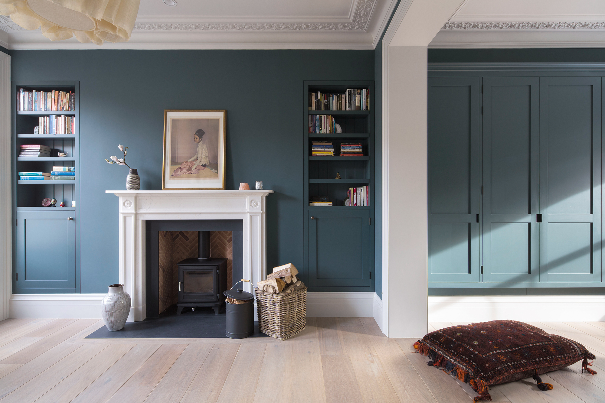 Stove placed in former fireplace in renovated Georgian property