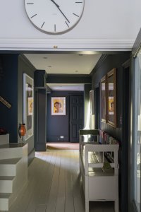 Hallway with wood flooring painted in eggshell