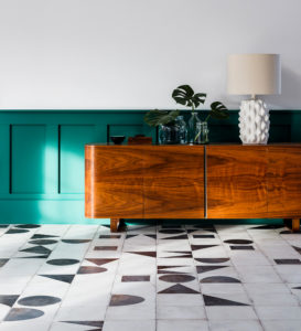 Hallway with vintage sideboard and porcelain flooring