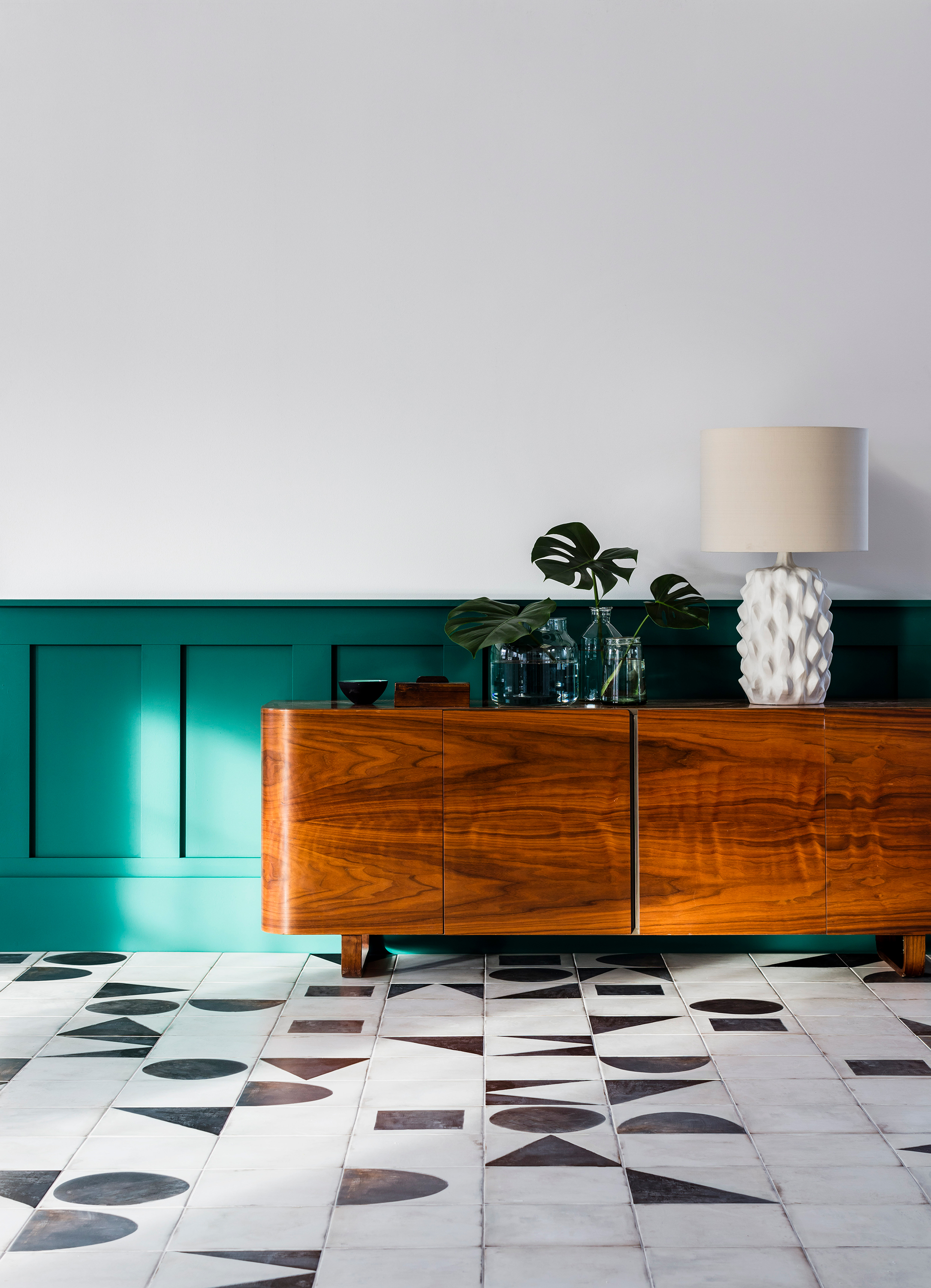 Hallway with vintage sideboard and porcelain flooring