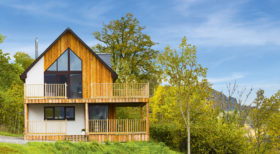 Kit timber frame home next to Loch Ness