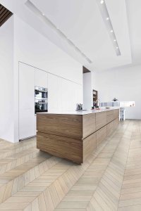 Modern kitchen with Chevron wood flooring