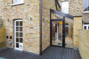 Timber frame extension with ample glazing to Victorian terrace