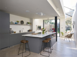Modern kitchen with island in Victorian terrace extension