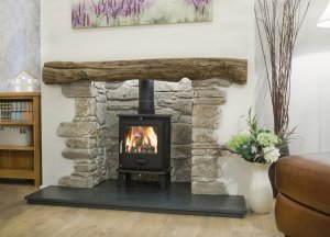Traditional look stove installed in former fireplace space
