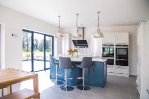 Kitchen-diner with kitchen island and bifold doors