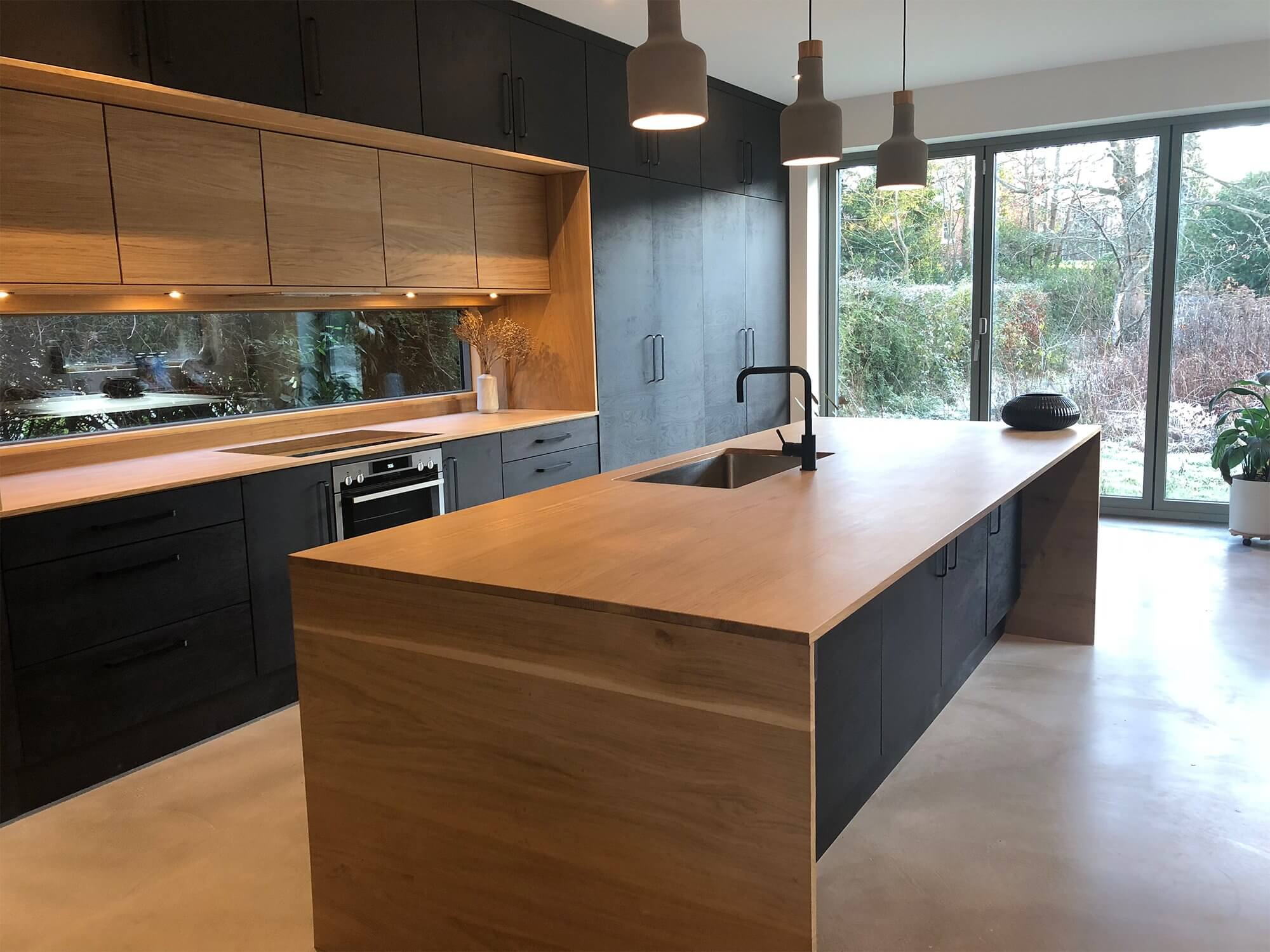 Modern kitchen with island and glazed doors