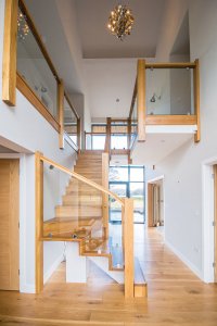 Timber staircase with glass balustrades