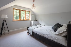 Bedroom with timber windows