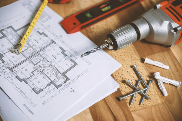 House plans and building tools on a table