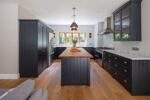 Wood kitchen with island feature and marble worktops