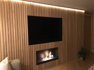 Ash feature wall with LED TV and fireplace