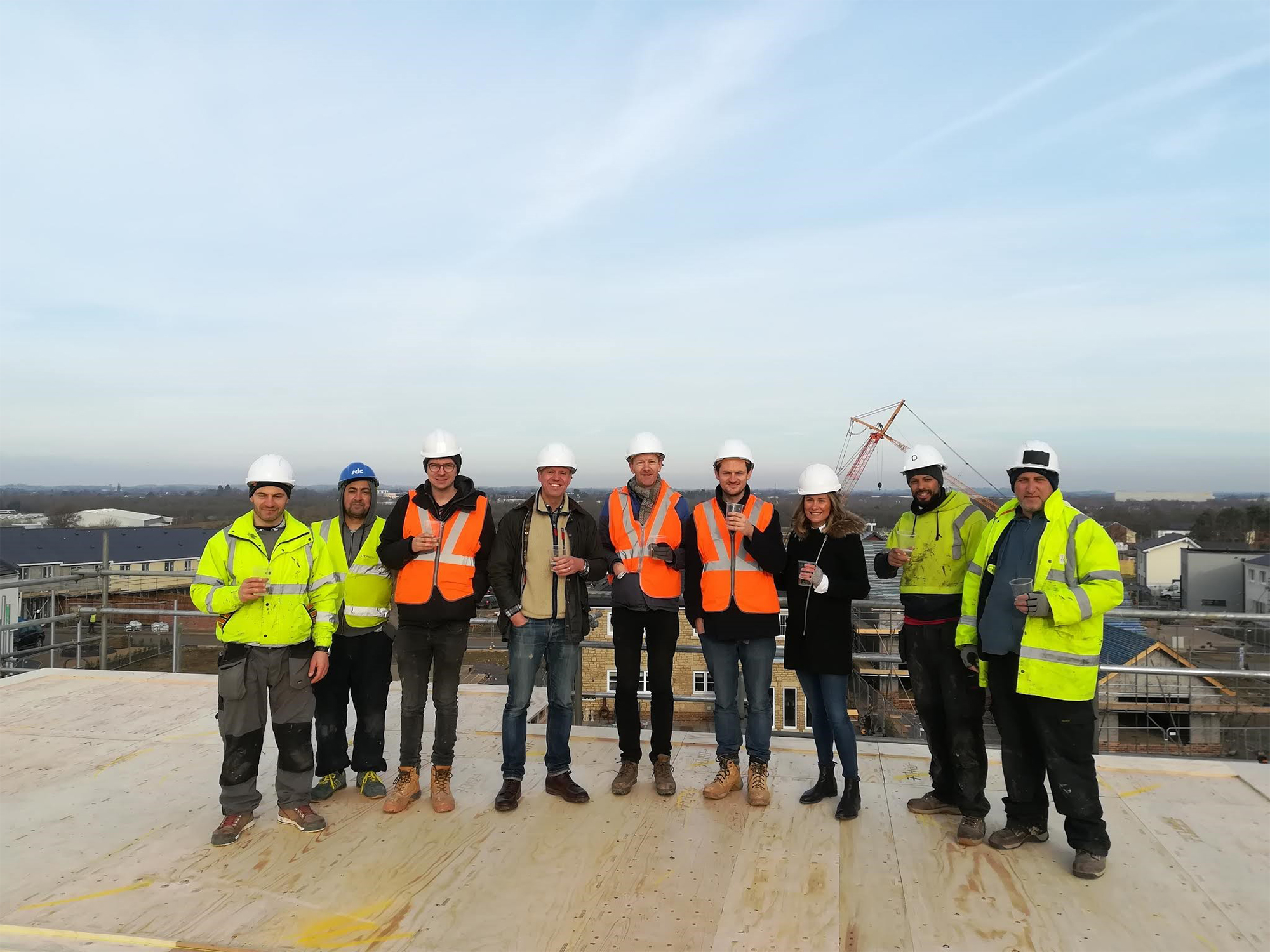 Marc and Laura with the builders on site