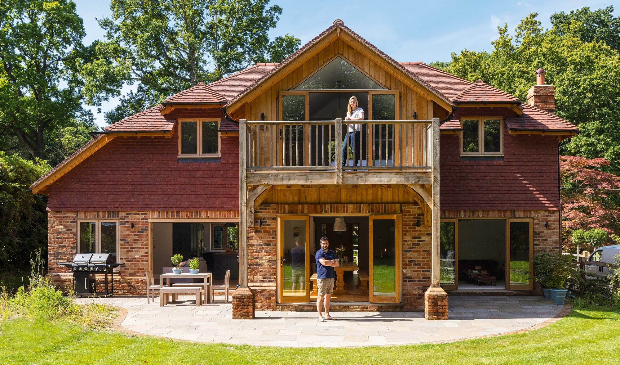 Lee & Amber Wilmot at their timber frame home in West Sussex