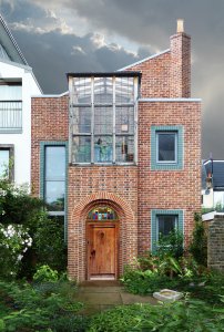 Front of arts and crafts brick home in London