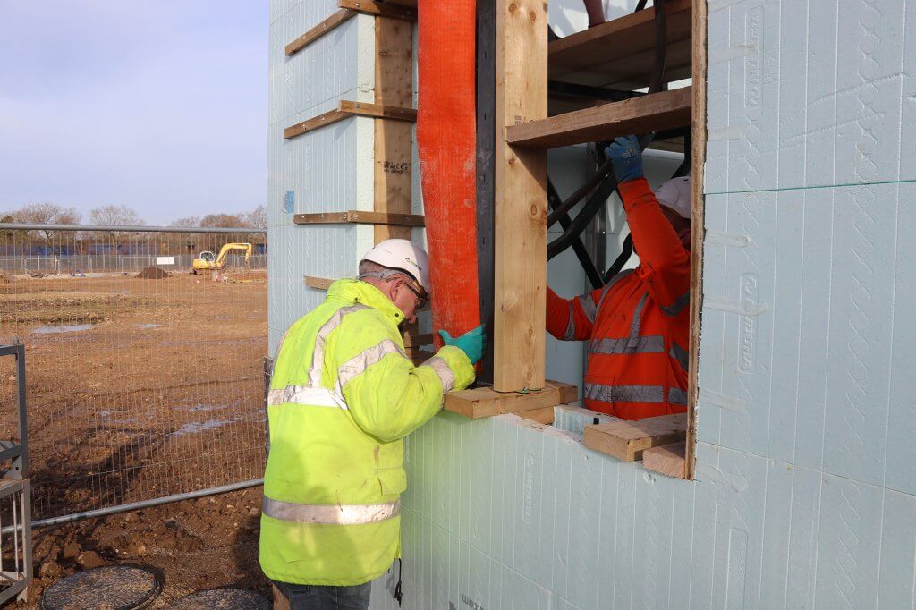 Pouring concrete below window opening