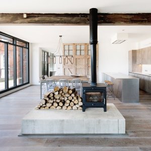 Stove in open plan space in ambulance station conversion