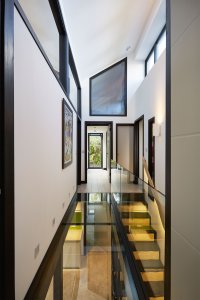 Hallway and first floor landing with glazed flooring