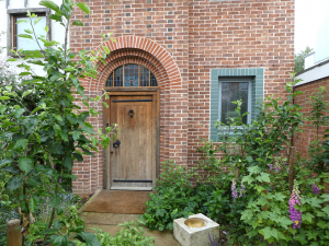 Entrance of arts and crafts brick home in London