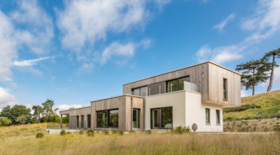 Contemporary home clad in timber and render