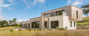 Contemporary home clad in timber and render