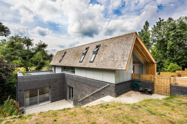 Contemporary timber frame home on sloping site by Frame Technologies