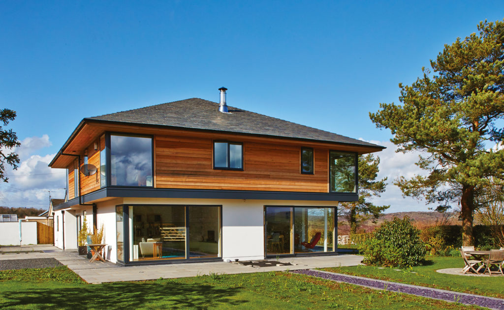 Timber frame home with cantilevered first floor