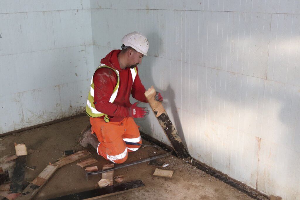 Removing the temporary formwork for the drainage channels