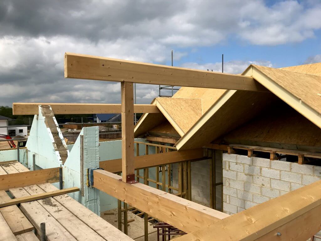 Glulam ridge beam and SIPs panels