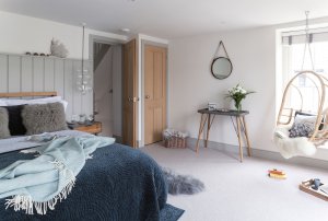 Large bedroom with neutral colour palette