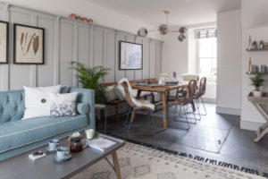 Open-plan living/dining area with repurposed slate flooring