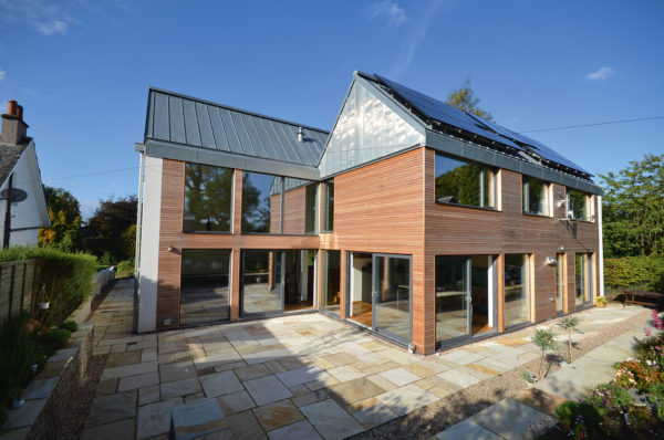 Passivhaus clad in timber, glass and zinc