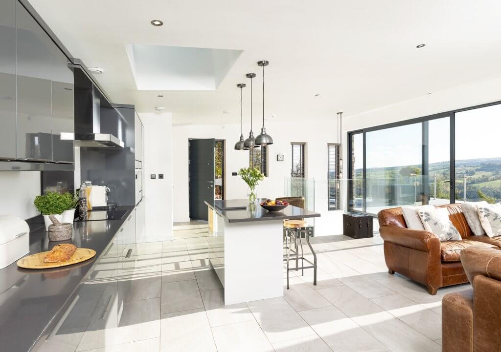 Open-plan kitchen with floor-to-ceiling glazing