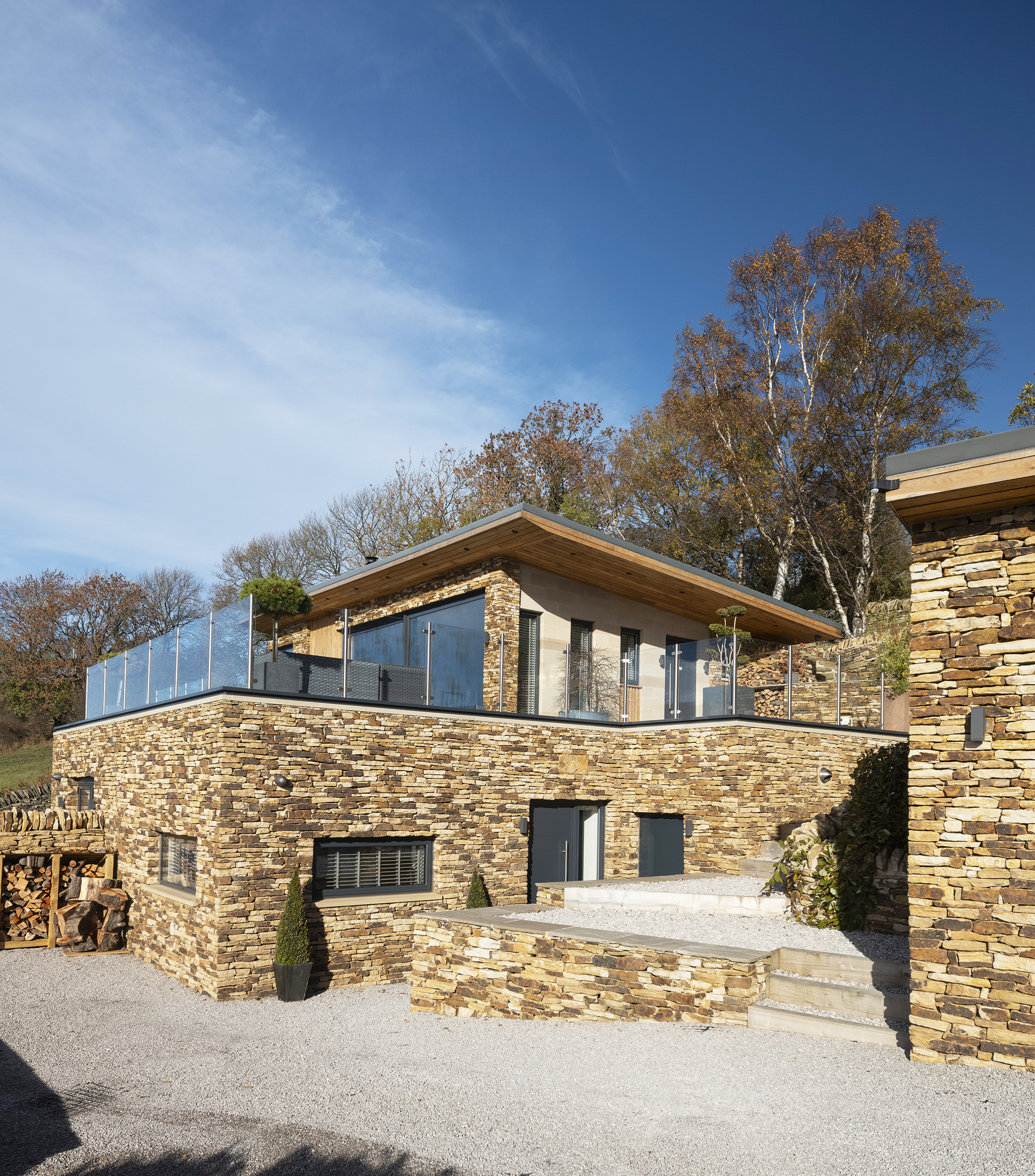 House exterior with glazed roof terrace in Bolsterstone