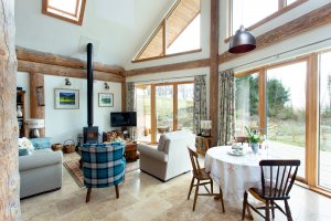 Living room with a woodburning stove and glass doors