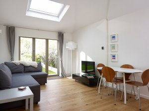 Contemporary living room with varnished floorboards