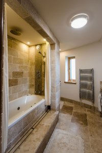 Raised stone bath