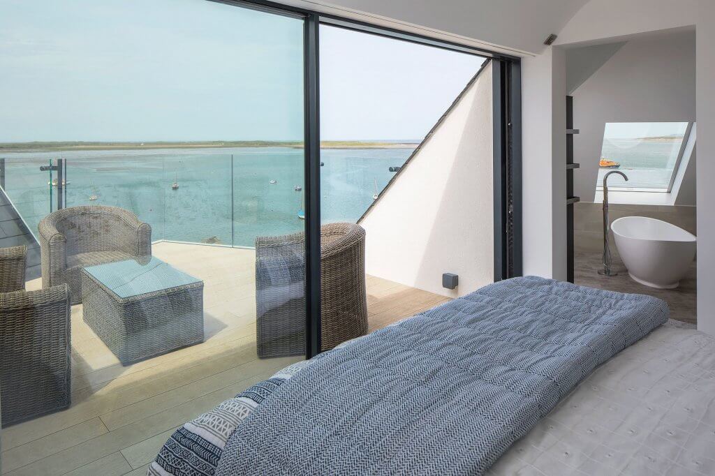 contemporary bedroom with sliding glass doors