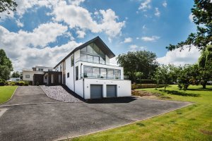 large composite windows line the house