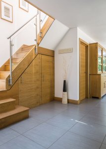 Timber staircase in airy hallway