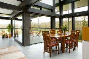Light dining area has sliding doors and outside seating