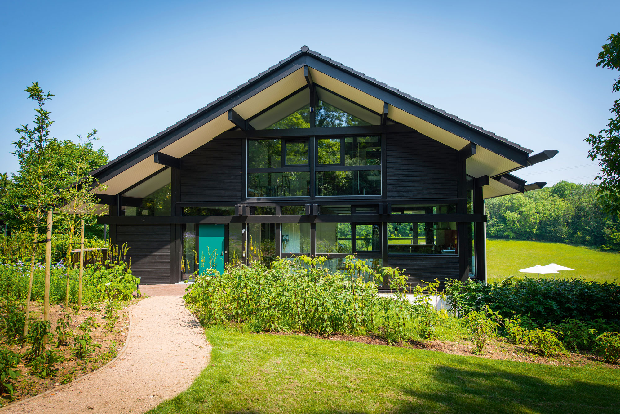 The exterior is clad with triple glazing windows and 10kW solar electric panels