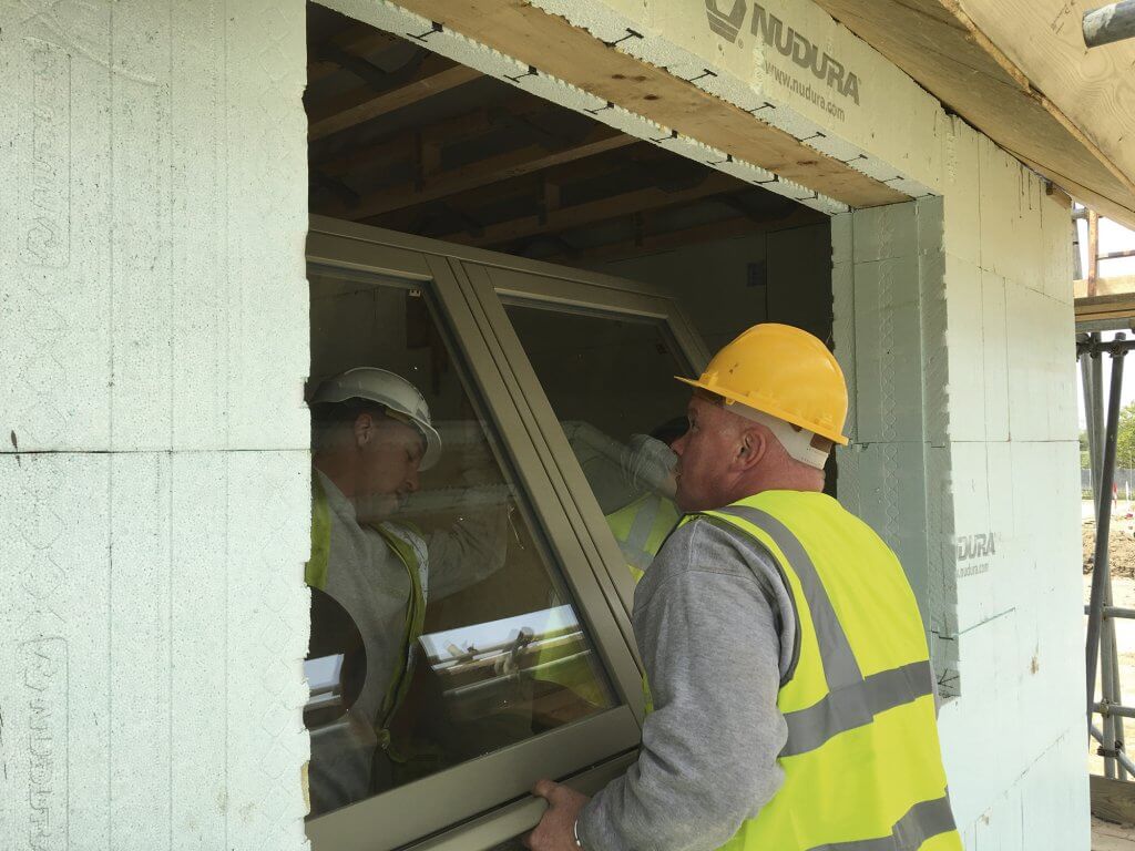 A Kloeber window being fitted at the Build It Education House