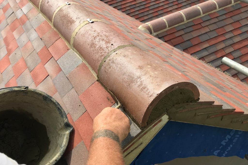 Hybrid fix muck and mechanical ridge tile