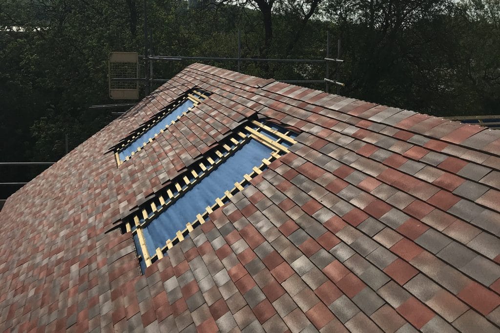 Tiled roof with openings for Velux windows
