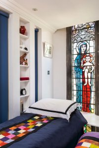 Bedroom with stained glass window