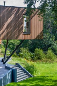 Contemporary timber clad house on stilts