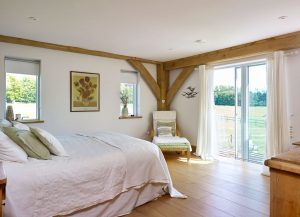 Bright bedroom with exposed floorboards