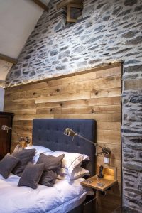 Exposed brick wall in bedroom