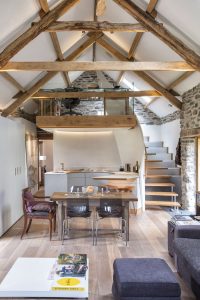 Open plan exposed beam living room